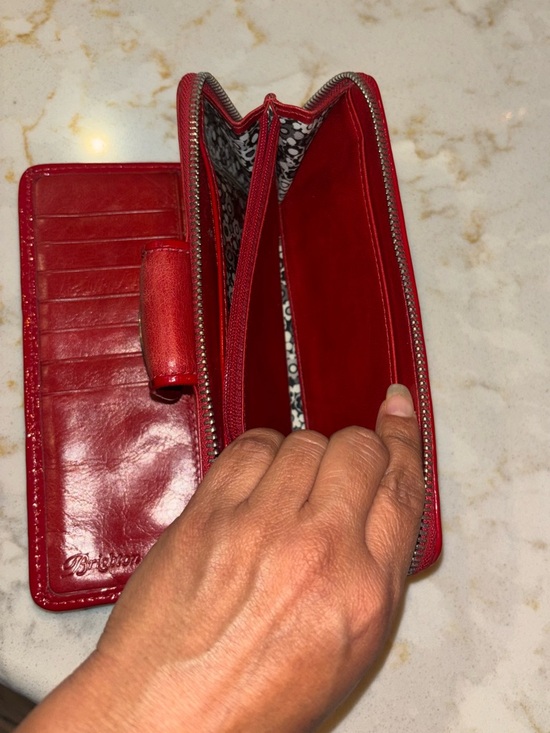 Brighton Red leather wallet featuring a decorative silver-toned snap closure. - Picture 7 of 16